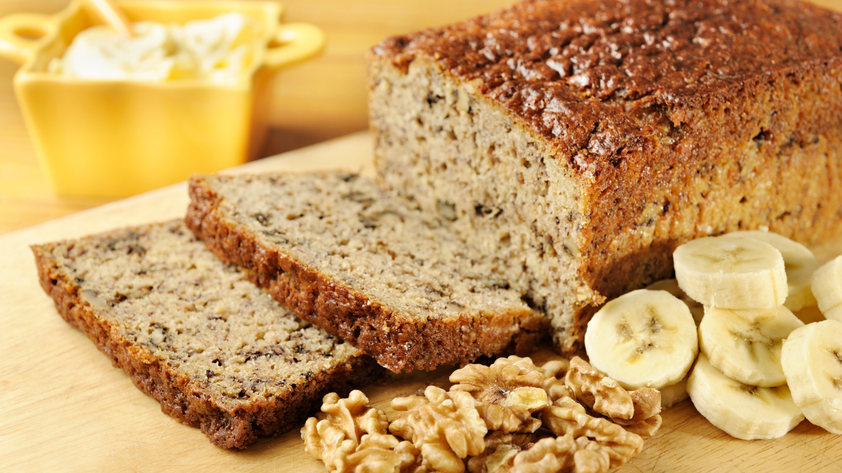 Banana bread at work sliced and served with coffee, a perfect treat to enhance office culture and teamwork.